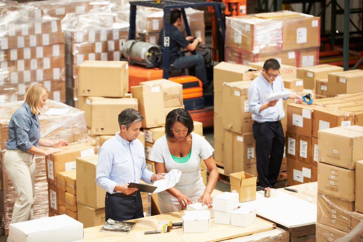 happy-men-with-tablet-pc-and-forklift-at-warehouse-PR2CLBG