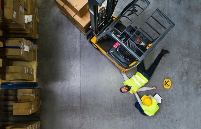 warehouse-workers-after-an-accident-in-a-warehouse-P6UAHMW The Ins And Outs Of Warehouse Safety blog post featured image