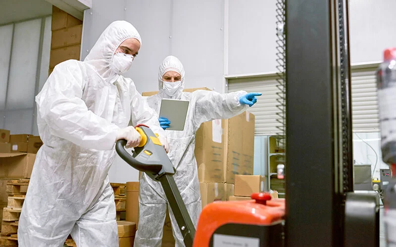 working-process-in-factory-warehouse-SWDHF3R Warehouse Management Safety Tips During A Pandemic blog post featured image