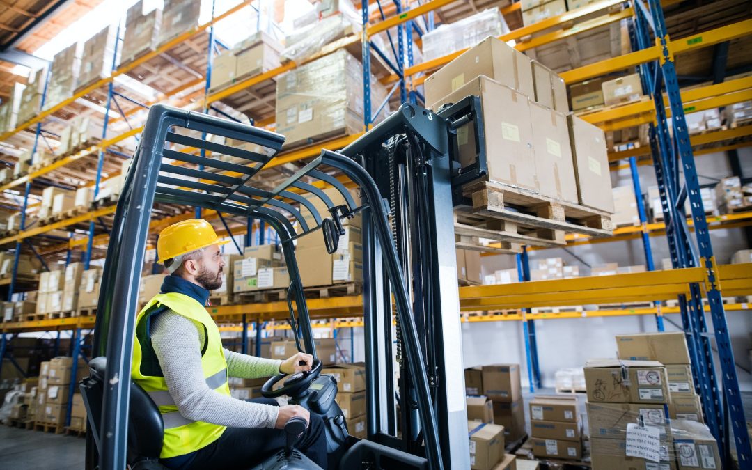 Warehouse man worker with forklift.