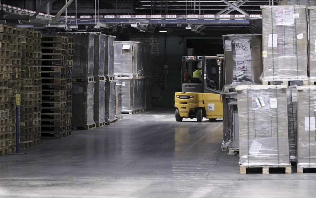 Fork lifter work in big warehouse. Clip. Warehouse man worker with forklift. Warehouse Rack of the