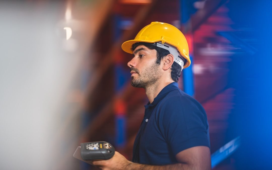 Male warehouse worker portrait in warehouse storage