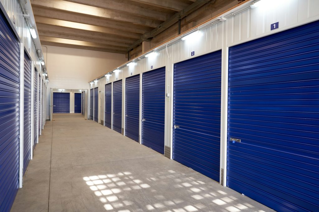 Long narrow corridor with storage in an industrial building for rental